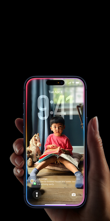 Hand holding iPhone 17 Pro, Message pop-up on personalized Lock Screen